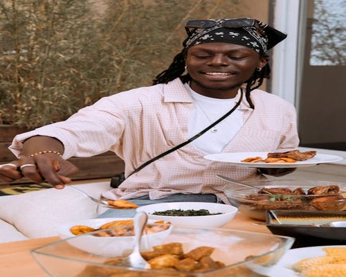 A family sitting together enjoying a home-cooked Kenyan meal